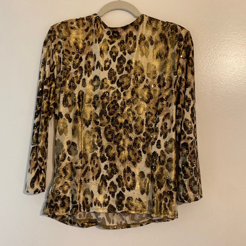 Dressy animal print top.  Had gold sparkles very flattering on the body